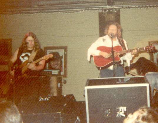 This was taken at a club in Athens, GA around 1982. It's David Allen Coe....and who is that on his right?? Could it be? YES! It is a young Warren Haynes!! Playing a Strat no less...Photo courtesy of Ken Krucina.